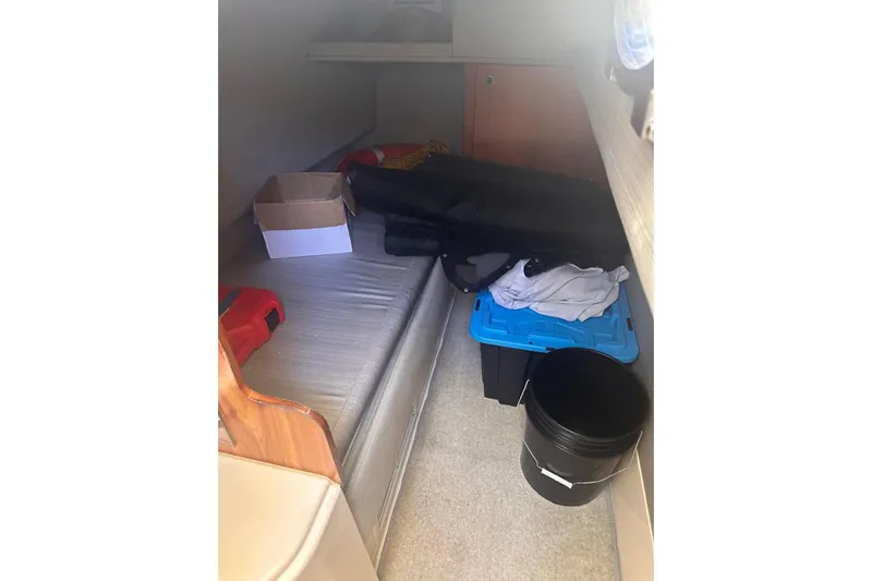 Splendor Yacht Photos Pics 2007 Azimut 55E yacht interior cabin with storage items and seating area.