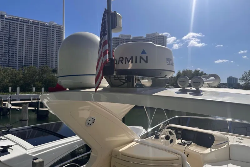 Splendor Yacht Photos Pics 2007 Azimut 55E yacht with Garmin radar, docked under clear blue sky.