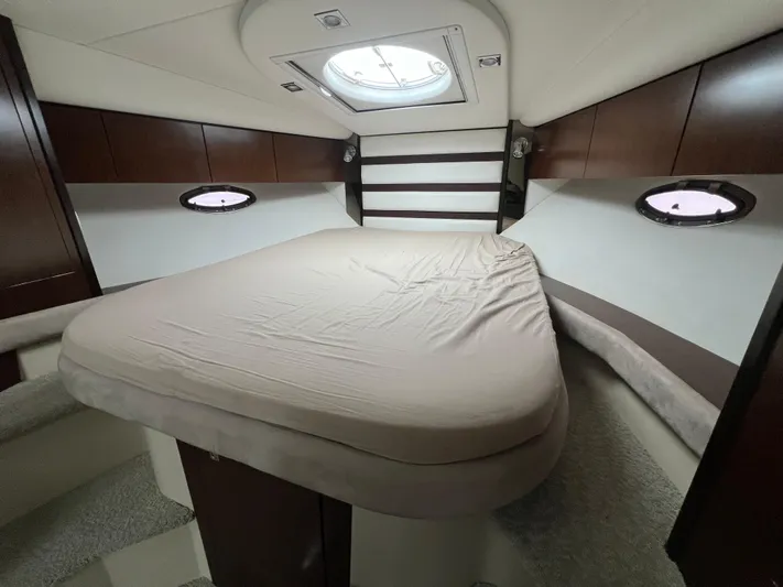  Yacht Photos Pics Luxurious cabin interior of 2012 Cruisers Yachts 350 Express with skylight and cozy bed.