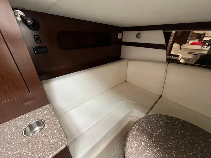  Yacht Photos Pics Interior of 2012 Cruisers Yachts 350 Express with white seating and wood accents.