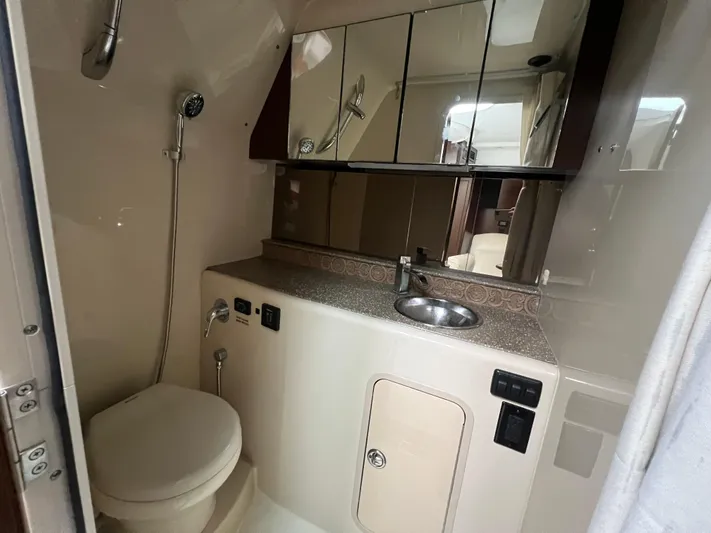  Yacht Photos Pics 2012 Cruisers Yachts 350 Express bathroom with shower, sink, and toilet.