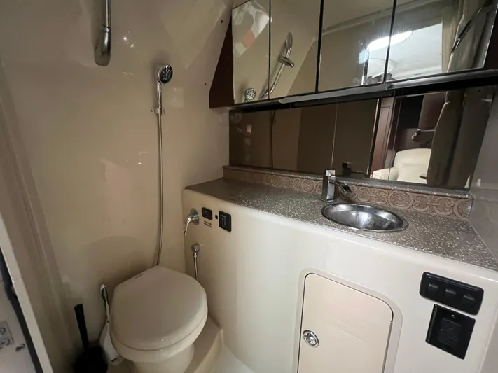  Yacht Photos Pics 2012 Cruisers Yachts 350 Express bathroom with shower, sink, and toilet.