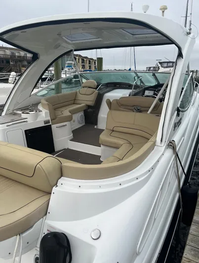  Yacht Photos Pics 2012 Cruisers Yachts 350 Express with beige interior, docked at a marina.