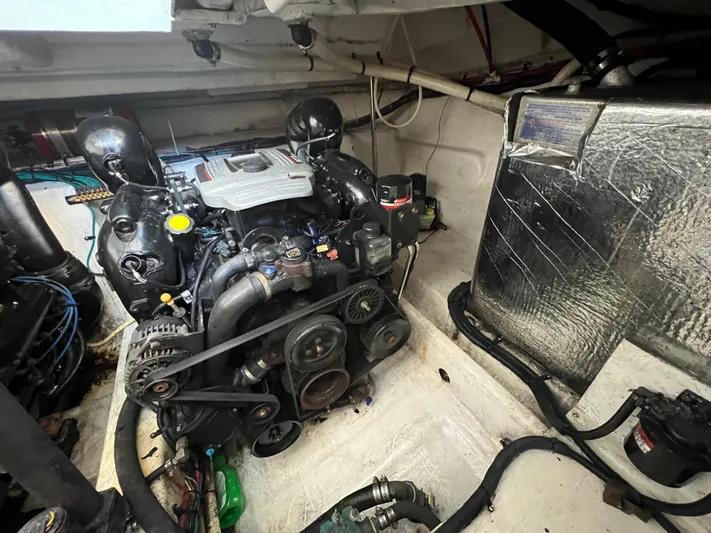  Yacht Photos Pics Engine compartment of 2012 Cruisers Yachts 350 Express, showcasing detailed mechanical components.