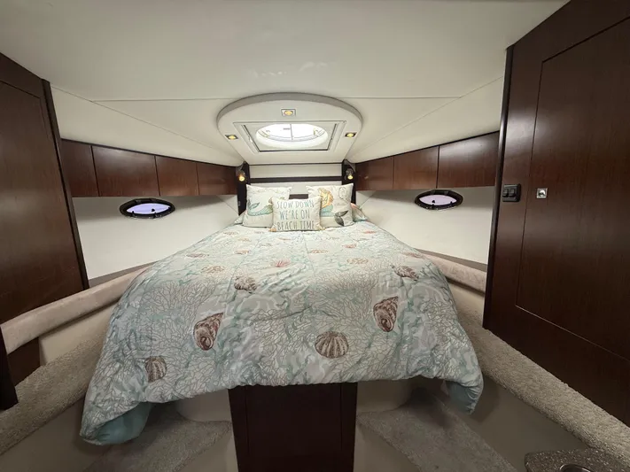  Yacht Photos Pics Luxurious cabin interior of 2012 Cruisers Yachts 350 Express with cozy bedding.