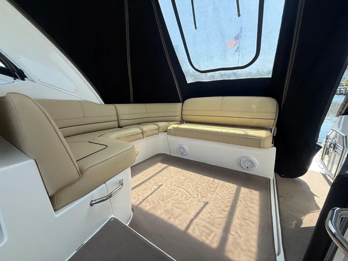  Yacht Photos Pics 2012 Cruisers Yachts 350 Express interior with beige seating and black canopy.