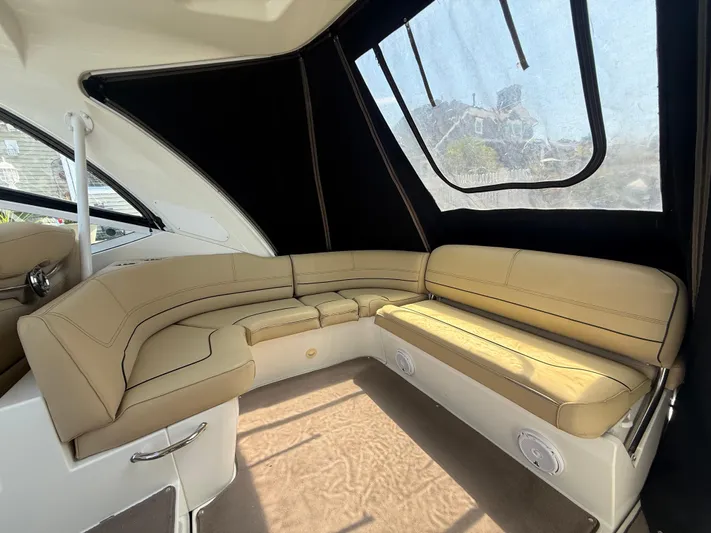  Yacht Photos Pics Interior of 2012 Cruisers Yachts 350 Express with beige seating and large windows.
