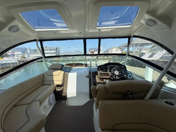  Yacht Photos Pics Interior of 2012 Cruisers Yachts 350 Express with luxurious seating and modern helm.
