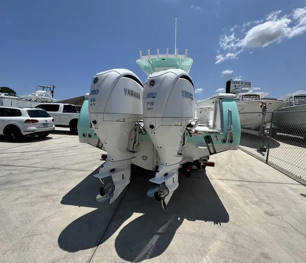  Yacht Photos Pics 2015 Southport 29 FE boat with twin Yamaha outboard engines in a sunny marina.