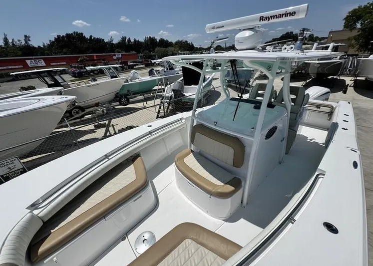  Yacht Photos Pics 2015 Southport 29 FE boat with tan seating, docked among other boats.