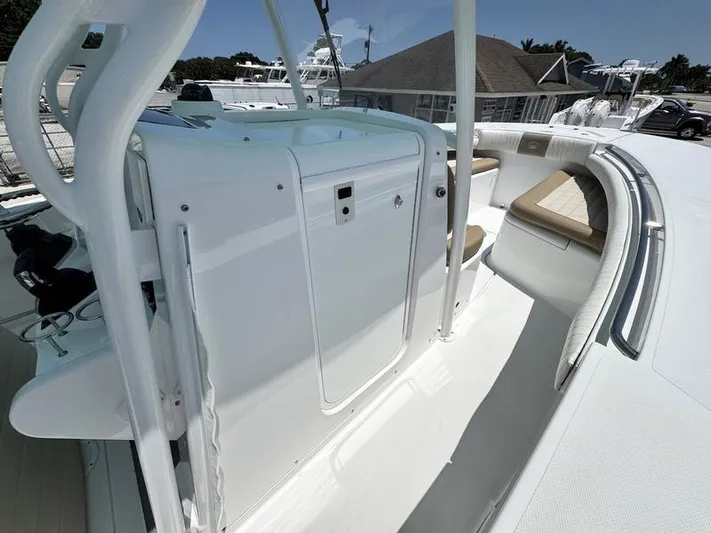  Yacht Photos Pics 2015 Southport 29 FE boat interior with white seating and storage area.