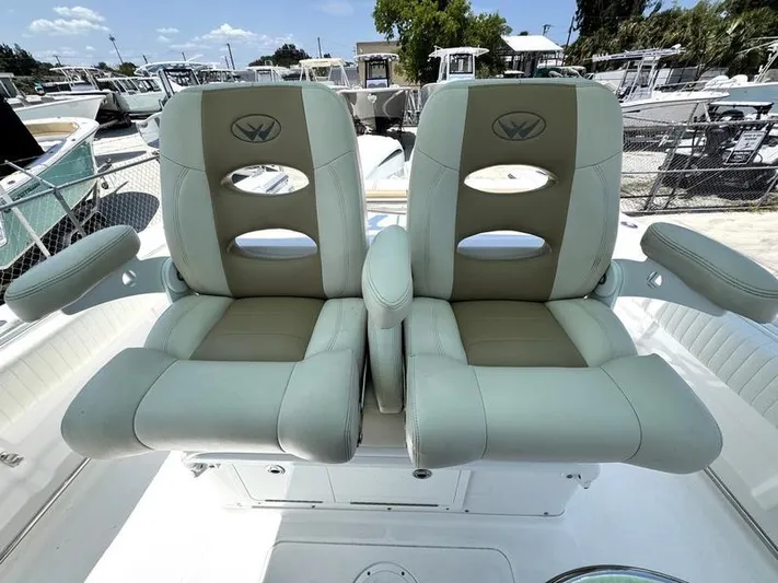  Yacht Photos Pics Luxury seating on 2015 Southport 29 FE boat, featuring plush dual captain's chairs.