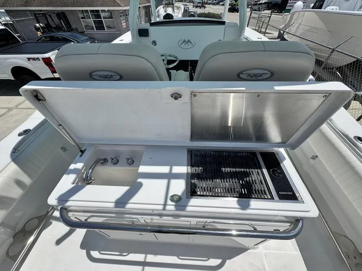  Yacht Photos Pics Outdoor kitchen on 2015 Southport 29 FE boat with grill and sink.