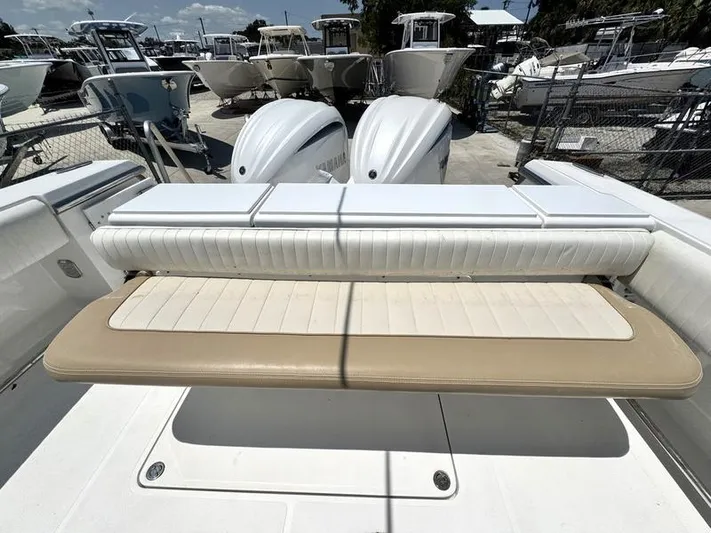  Yacht Photos Pics 2015 Southport 29 FE boat with foldable seating and twin engines in a marina.