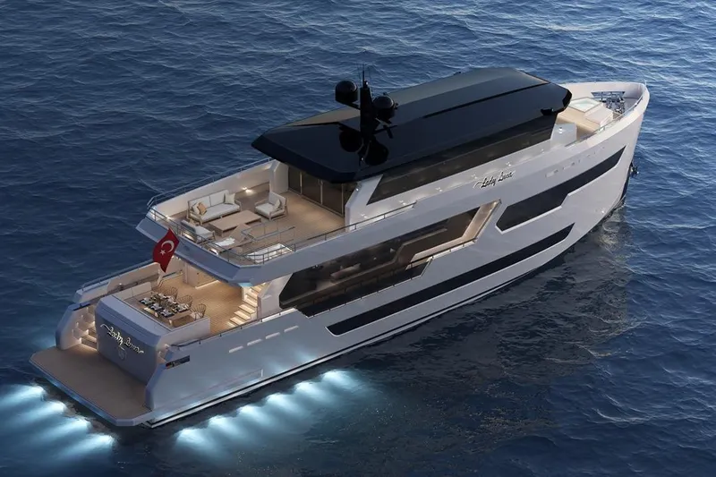  Yacht Photos Pics Luxurious 2027 KRC Yacht Dolphin 100 cruising on serene ocean waters at dusk.