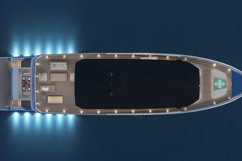 Yacht Photos Pics Aerial view of 2027 KRC Yacht Dolphin 100, illuminated deck at night.