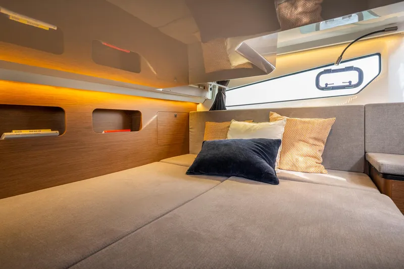 In Stock Yacht Photos Pics Interior of 2026 Beneteau Antares 11, featuring cozy bed and modern design elements.