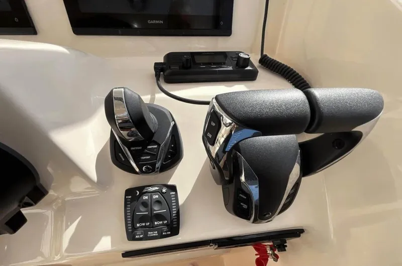  Yacht Photos Pics Control panel of 2022 Grady-White Freedom 307 boat with throttle and joystick.