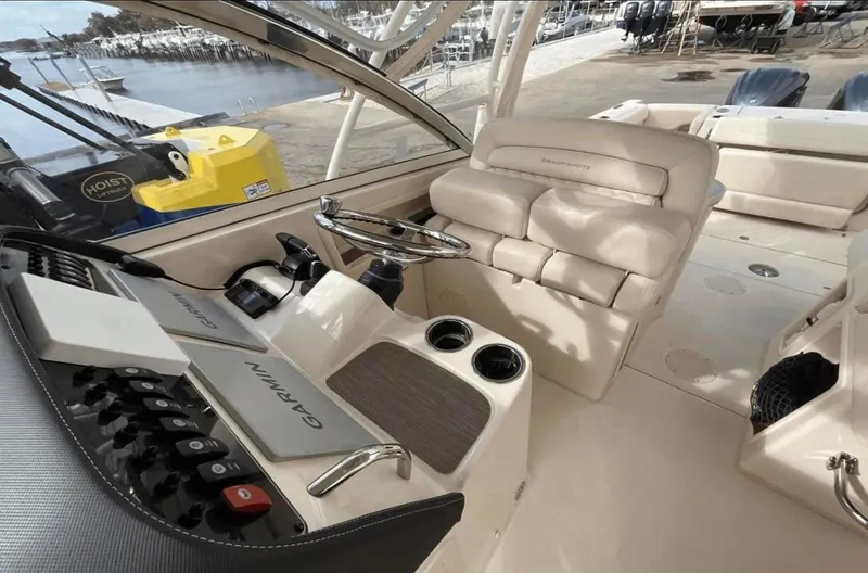  Yacht Photos Pics 2022 Grady-White Freedom 307 boat interior with helm, seating, and controls.