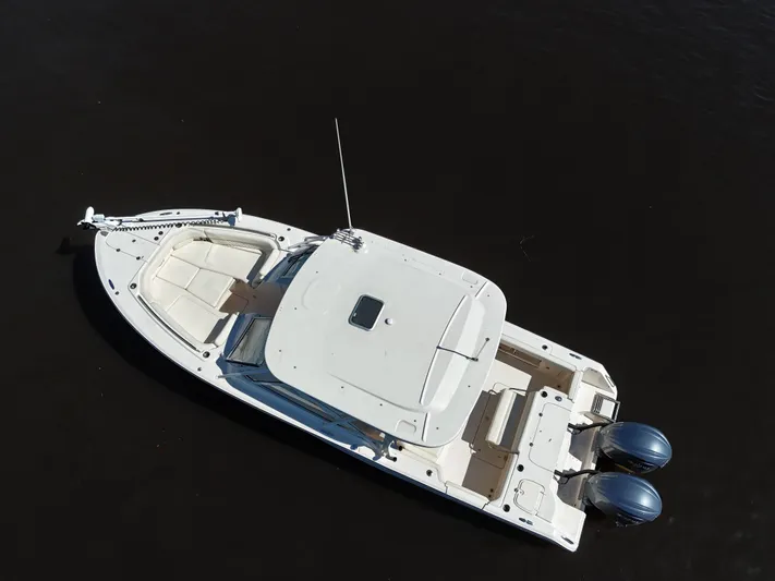  Yacht Photos Pics 2022 Grady-White Freedom 307 boat on dark water, aerial view.