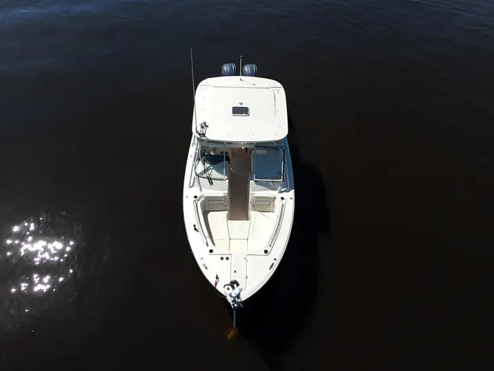  Yacht Photos Pics 2022 Grady-White Freedom 307 boat on calm water, aerial view.