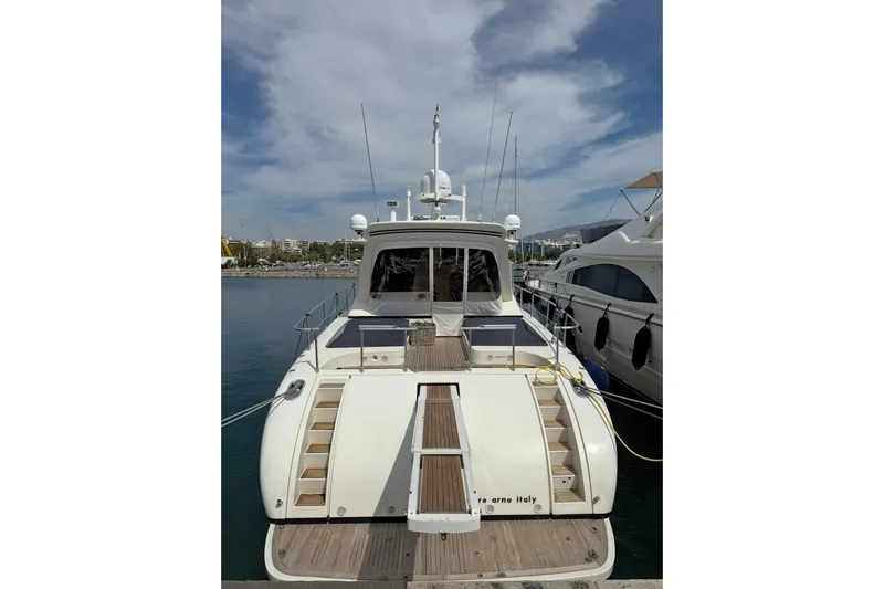 Slim Yacht Photos Pics Luxury 2006 Arno Leopard 23 HT yacht docked at marina under cloudy sky.