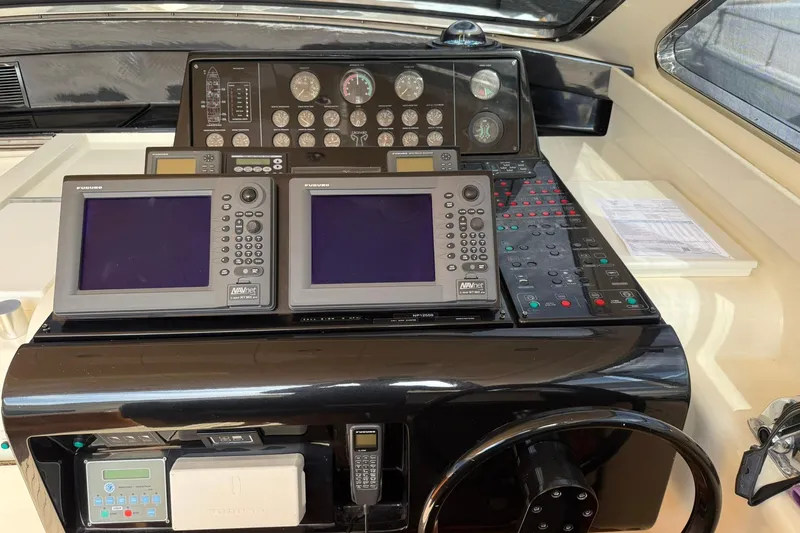Slim Yacht Photos Pics Control panel of a 2006 Arno Leopard 23 HT yacht with navigation equipment.