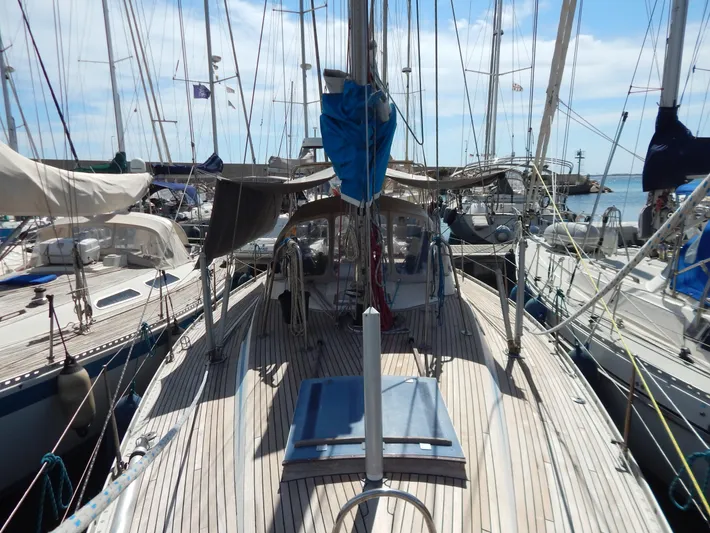  Yacht Photos Pics 1983 Nautor Swan 42 sailboat docked, showcasing deck and rigging under clear skies.