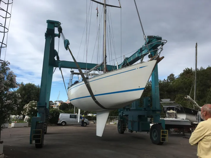  Yacht Photos Pics Nautor Swan 42 yacht from 1983 being lifted by a boat hoist.