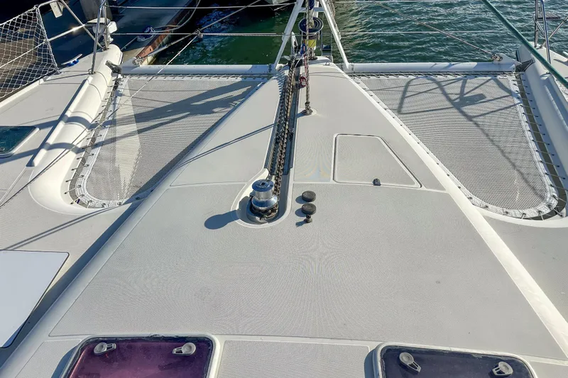 Mystic Yacht Photos Pics Deck view of a 2001 Privilege 435 catamaran with netting and winch.