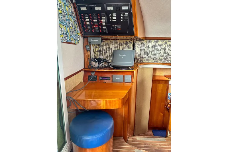 Mystic Yacht Photos Pics Navigation station on 2001 Privilege 435 yacht with control panel and Raymarine equipment.