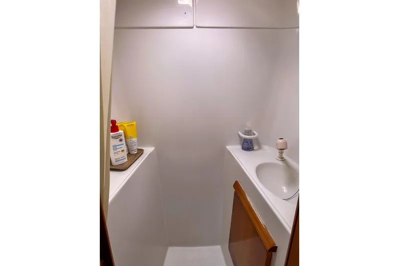 Mystic Yacht Photos Pics Compact bathroom in 2001 Privilege 435 yacht with sink and toiletries.