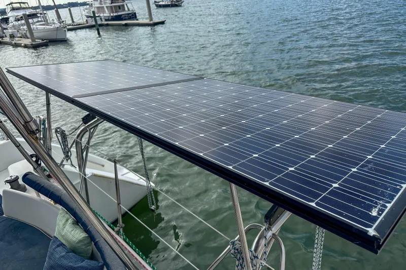 Mystic Yacht Photos Pics Solar panels on a 2001 Privilege 435 catamaran docked at a marina.