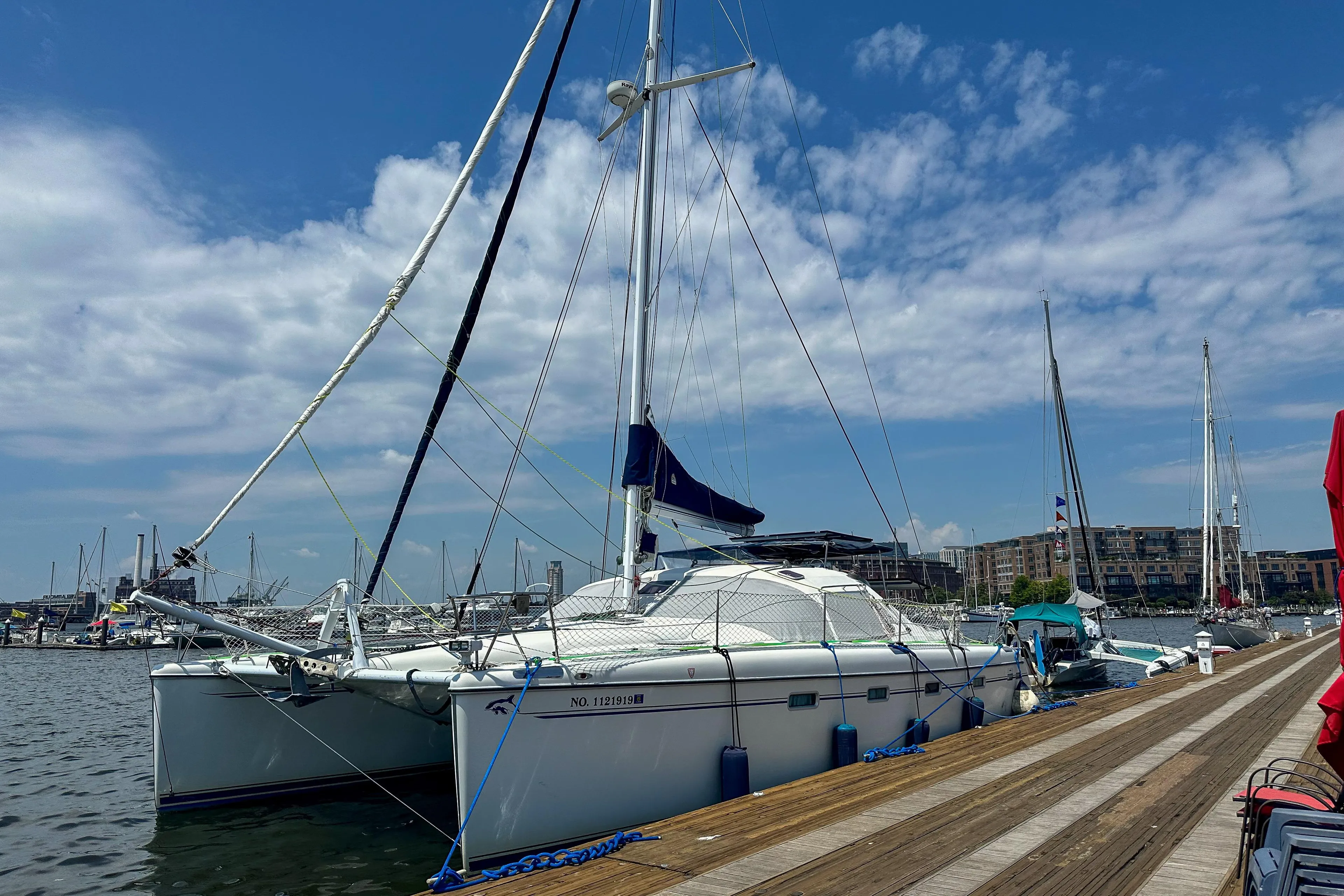 Sailboat Privilege 435, 2001 model, docked at marina under blue sky.