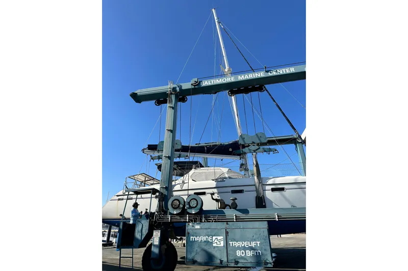 Mystic Yacht Photos Pics Catamaran Privilege 435 (2001) on a travel lift at Baltimore Marine Center.