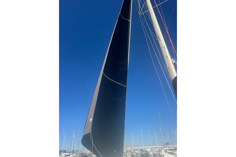  Yacht Photos Pics Sail of a 2016 Lagoon 42 catamaran against a clear blue sky.