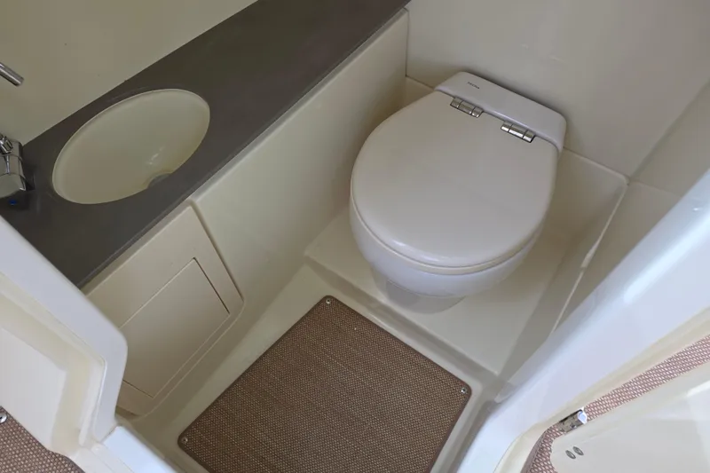  Yacht Photos Pics 2023 Chris-Craft Launch 28 GT boat bathroom with toilet and sink.