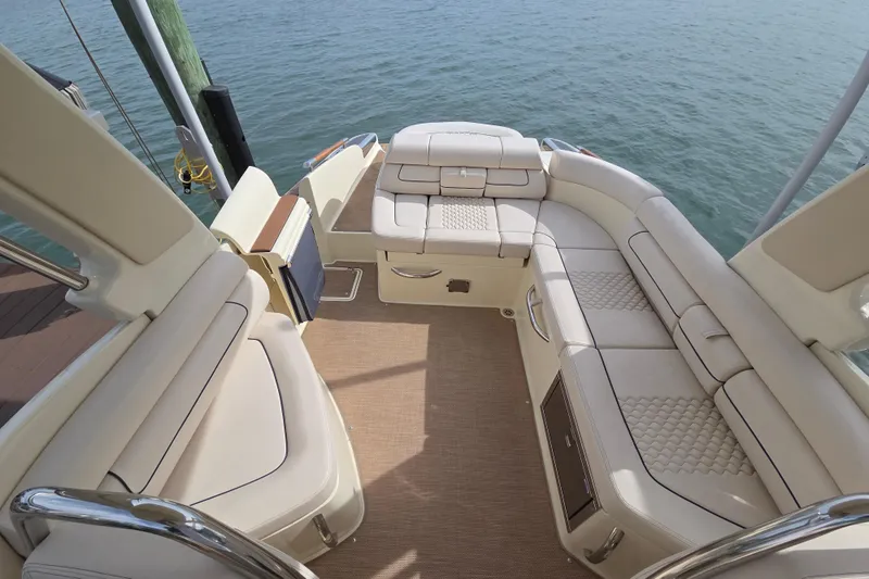  Yacht Photos Pics Luxurious seating on 2023 Chris-Craft Launch 28 GT boat, overlooking serene water.