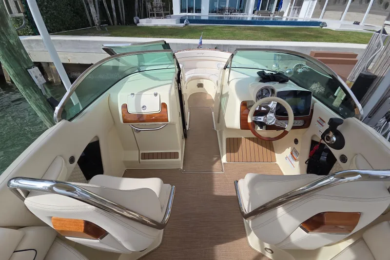  Yacht Photos Pics 2023 Chris-Craft Launch 28 GT boat interior with luxurious seating and modern dashboard.