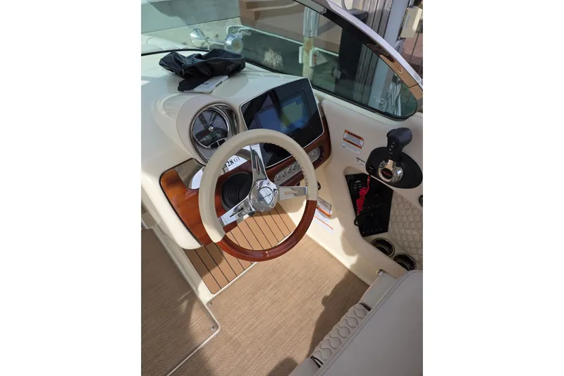  Yacht Photos Pics 2023 Chris-Craft Launch 28 GT dashboard with steering wheel and controls.