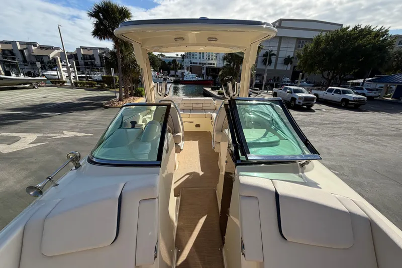  Yacht Photos Pics 2023 Chris-Craft Launch 28 GT boat interior with open deck and seating area.