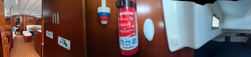 Traveler Yacht Photos Pics Interior of 2002 Beneteau 473 yacht, featuring wooden cabinetry and safety equipment.