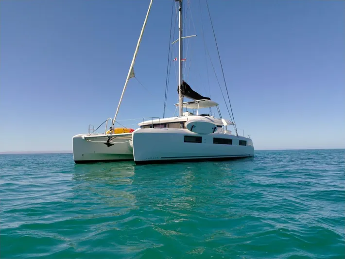  Yacht Photos Pics 2018 Lagoon 50 catamaran sailing on calm blue waters under clear sky.