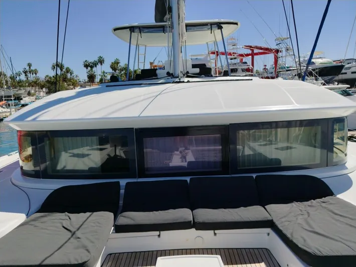  Yacht Photos Pics 2018 Lagoon 50 catamaran with spacious deck and seating, docked at marina.