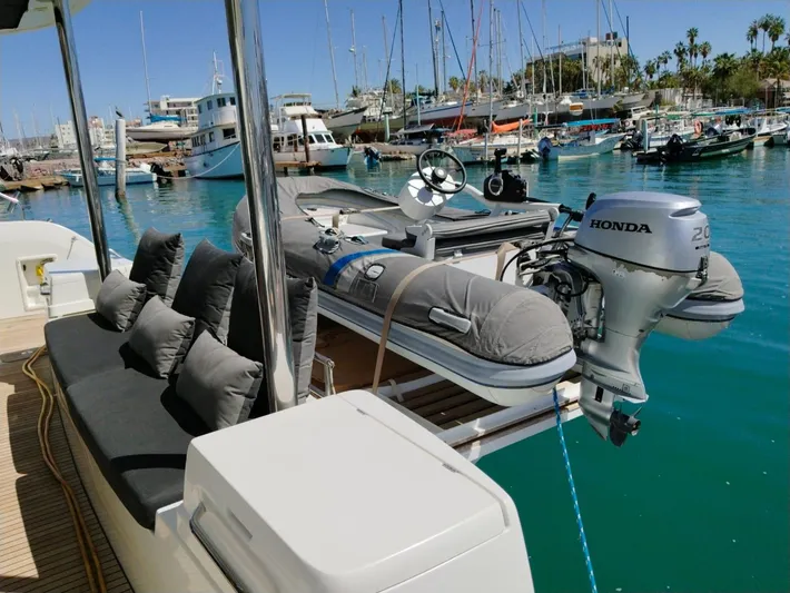  Yacht Photos Pics Lagoon 50 catamaran with Honda outboard motor in a marina, 2018 model.