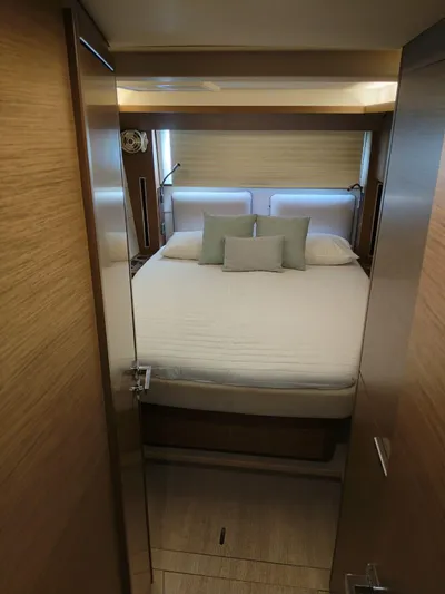  Yacht Photos Pics Luxurious cabin interior of 2018 Lagoon 50 yacht with cozy bedding.