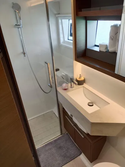  Yacht Photos Pics Modern bathroom in 2018 Lagoon 50 yacht with shower, sink, and storage.
