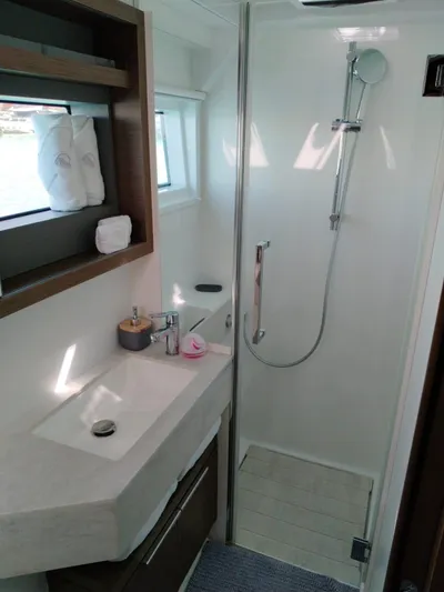  Yacht Photos Pics 2018 Lagoon 50 yacht bathroom with modern shower and sink.