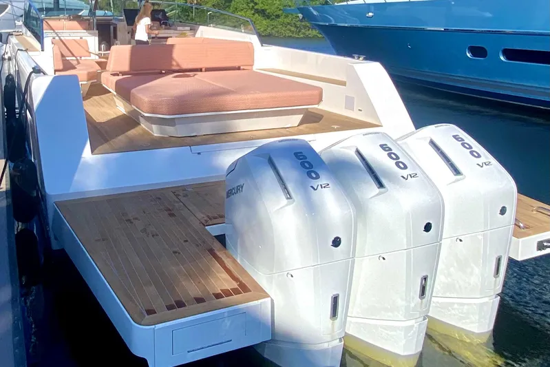  Yacht Photos Pics 2024 Delta Powerboats 60 Open with triple Mercury V12 engines, featuring spacious deck and seating.