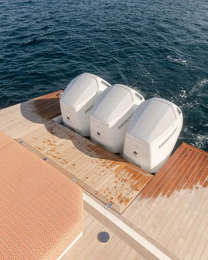  Yacht Photos Pics 2024 Delta Powerboats 60 Open with triple Mercury outboard engines on teak deck.